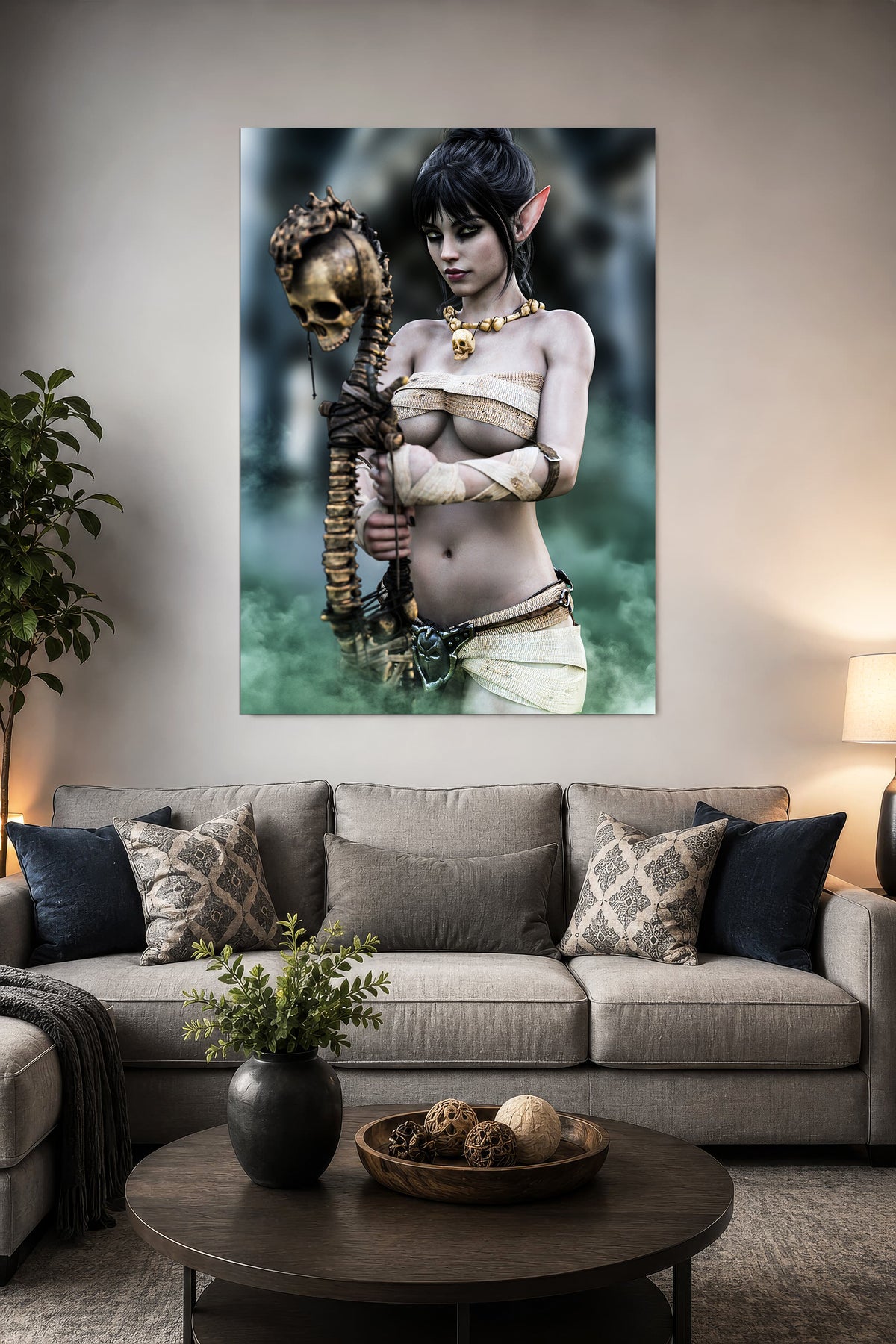 Dark elf necromancer fantasy wall art displayed above a gray sofa in a modern living room, featuring a female dark elf with skull staff.