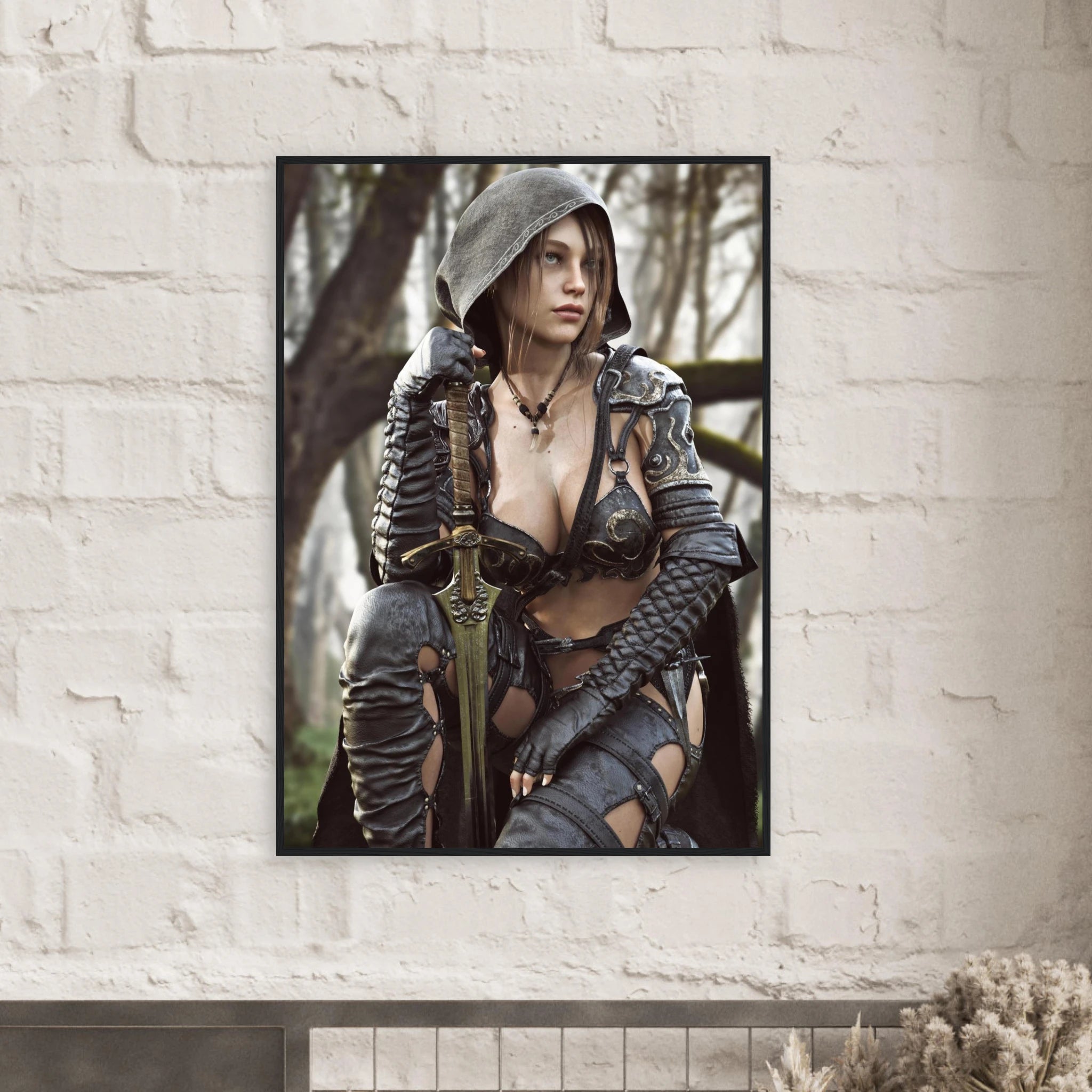 A framed vertical art print depicting a fantasy female warrior in dark armor and a hood, leaning on a sword, displayed on a white brick wall.