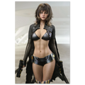 A fashion runway-style photo of a woman modeling a futuristic black outfit with a metallic black bra top, sheer black long sleeves, a black faux-leather vest, a black patterned mini skirt, and black thigh-high stockings, while holding two black pistols. The background is a clean, light gray runway setting.