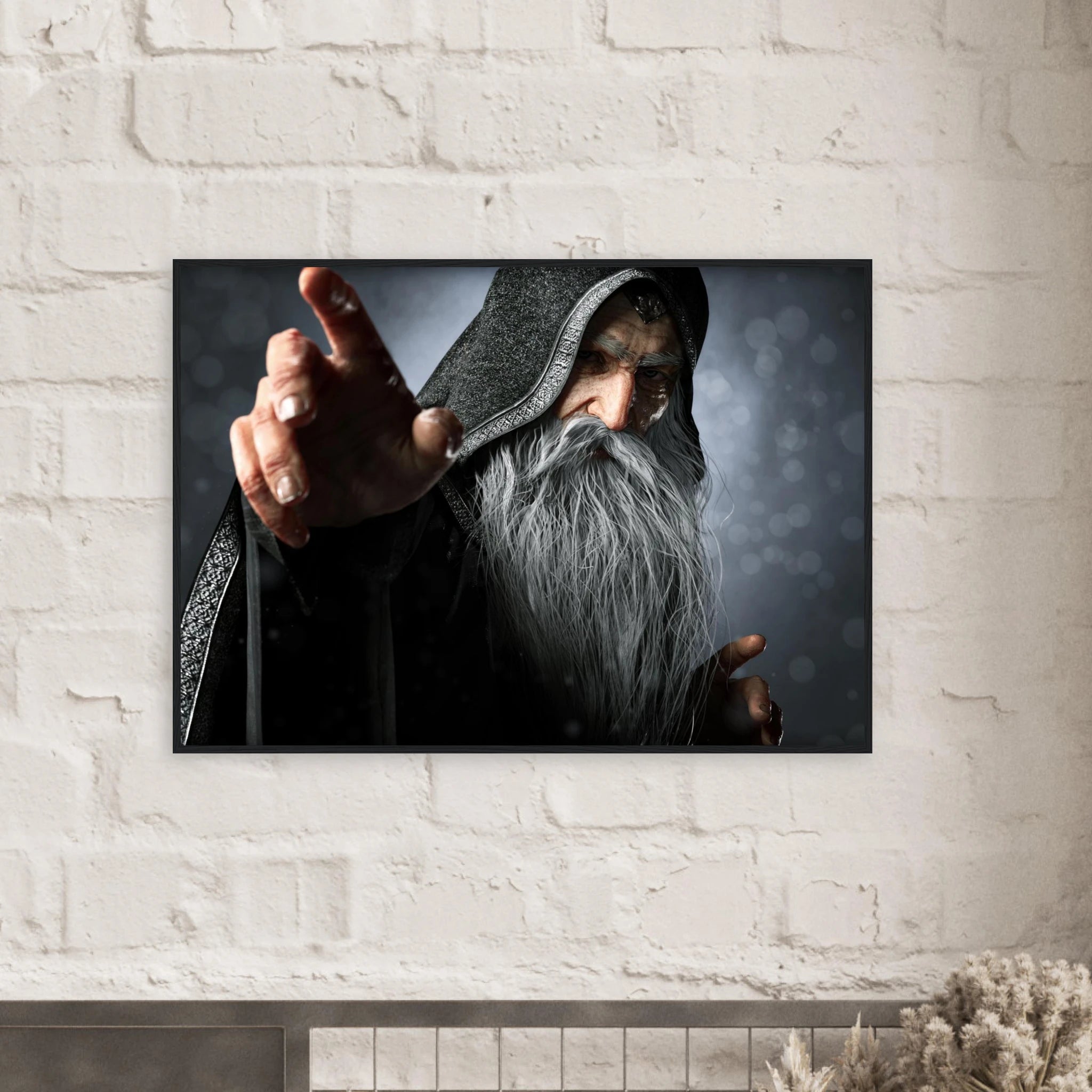 A rectangular wall art print showing a hooded wizard with a long gray beard pointing forward, mounted on a white painted brick wall above a mantel.