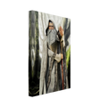 A vertical canvas wall art print showing an elderly wizard or elf-like figure in a long gray robe holding a staff, photographed against a plain white background.