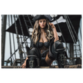 Handcrafted fantasy artwork featuring a confident female pirate captain seated aboard a legendary sailing ship, wearing a black tricorne hat, elegant corset, and towering leather pirate boots. Surrounded by weathered rigging, wooden beams, and towering black sails, she commands the deck with calm authority and unmistakable presence. Rich cinematic lighting, detailed nautical textures, and realistic craftsmanship evoke the romance and danger of the golden age of piracy, making this artwork an exceptional pie