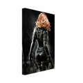 Handcrafted fantasy artwork depicting a highly skilled redheaded assassin viewed from behind as she walks through swirling smoke beneath dramatic overhead light. Wearing a sleek black tactical bodysuit with reinforced armor, twin shoulder-mounted blades, thigh holsters, and dual pistols held at her sides, she projects quiet confidence and deadly precision. Rich cinematic lighting highlights the realistic textures of her combat gear while the dark, atmospheric background emphasizes the mystery of a professio